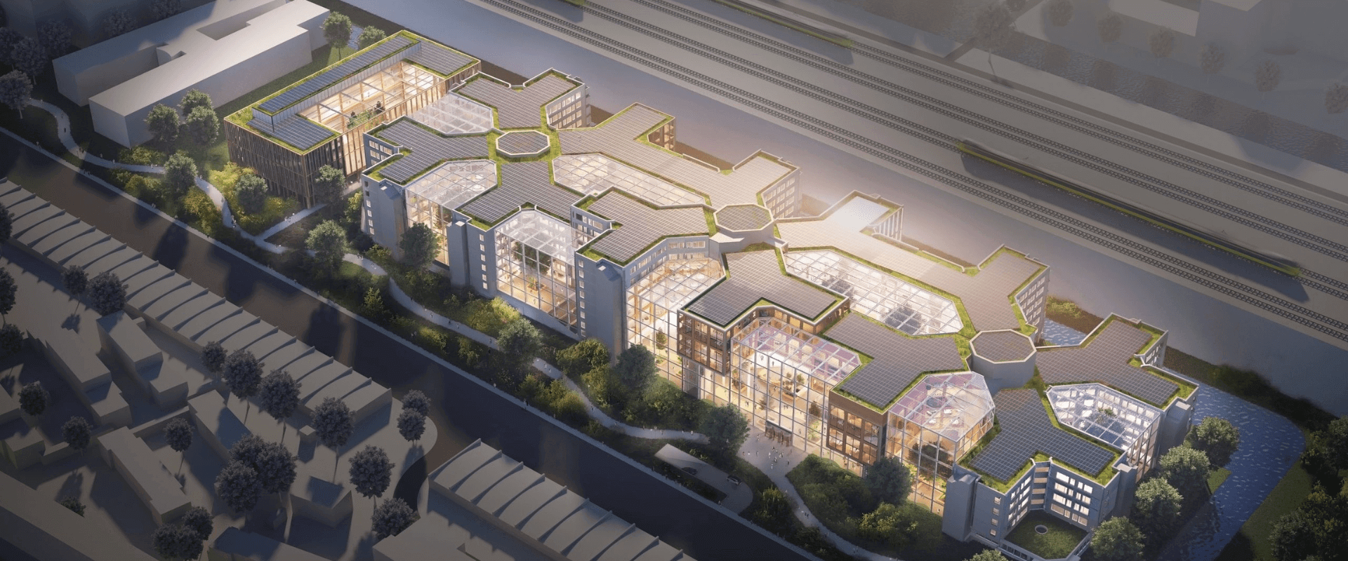 Luchtfoto van het nieuwe ABN AMRO-hoofdkantoor in Amsterdam met moderne architectuur en veel glazen panelen.