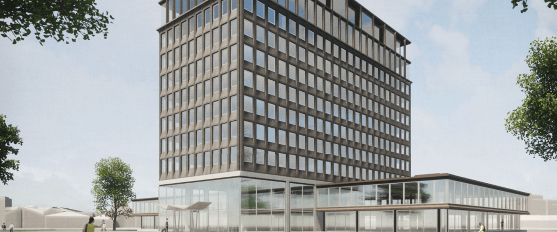 Staal-Kade Amsterdam: een modern, duurzaam kantoorgebouw met strakke architectuur, grote ramen en groen in de omliggende omgeving.