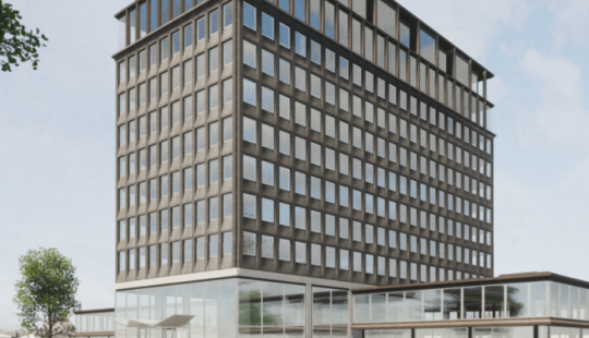 Staal-Kade Amsterdam: een modern, duurzaam kantoorgebouw met strakke architectuur, grote ramen en groen in de omliggende omgeving.