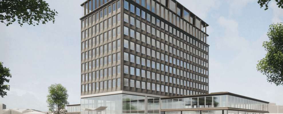 Staal-Kade Amsterdam: een modern, duurzaam kantoorgebouw met strakke architectuur, grote ramen en groen in de omliggende omgeving.